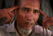 Nonprofit Says Rohingya Men Also Victims of Sexual Violence In this Tuesday, Nov. 28, 2017, photo, Shafir Rahman, 50, describes how he watched a soldier hammering a four-inch nail into the side of a man's head with a rifle butt during an interview with The Associated Press in his tent in Jamtoli refugee camp in Bangladesh. Photo: Wong Maye-E / Associated Press