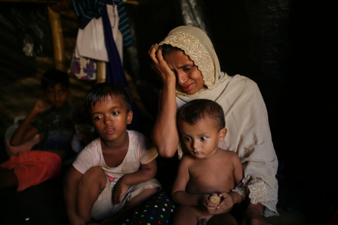 Jamila Begum, 35, cries in 2017 when talking about how members of Myanmar's armed forces accused of massacring civilians in her village Maung Nu, in Myanmar's Rakhine State. Photo: Wong Maye-E / Associated Press