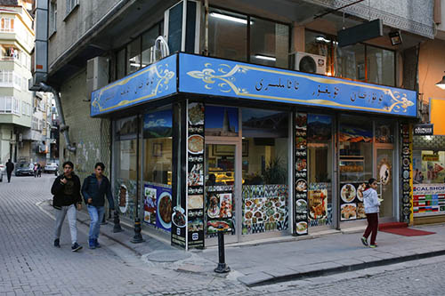 Residents stroll by shops in the immigrant neighborhood of Zeytinburnu. Since 2013, thousands of Uighurs, a Turkic-speaking Muslim minority from western China, have traveled to Syria to train and fight alongside al-Qaida, playing key roles in several battles. Photo: Emrah Gurel / Associated Press