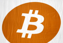Thailand Bans Cryptocurrency Payments for Goods and Services A bitcoin logo is displayed at a 2014 Inside Bitcoins conference and trade show in New York. Photo: Mark Lennihan / AP