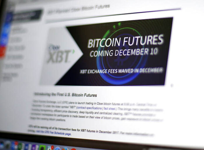 The Chicago Board Options Exchange website announces that bitcoin futures will start trading on the CBOE on Sunday evening. Photo: Kiichiro Sato / Associated Press