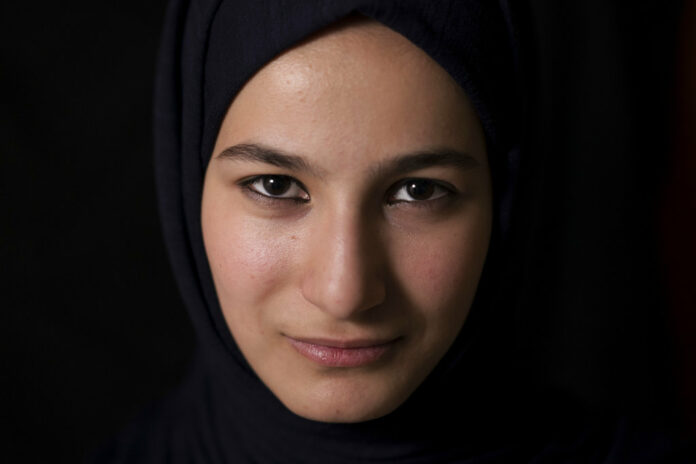 Islamic State Ferahs World Ferah poses for a photo in her home in Mosul, Iraq, in this photo taken Saturday, Nov. 4, 2017. Ferah was just turning 14 and starting to look to the future when the Islamic State group took over Mosul in 2014, throwing her world into darkness. Photo: Felipe Dana / Associated Press