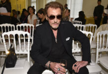 French Rock Icon, Johnny Hallyday, 74 French rock singer Johnny Hallyday waits July 6, 2016, before Christian Dior's Haute Couture Fall-Winter 2016-2017 fashion collection presented in Paris, France. Photo: Zacharie Scheurer / Associated Press