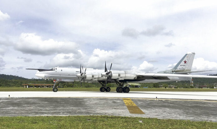 A Russian Tu-95 bomber arrives on Biak Island in Indonesia in a photo released Tuesday. The visit by the bombers capable of carrying nuclear weapons seems to underline Russia's resurgent military might and its desire to expand its foothold around the world. Photo: Russian Defense Ministry Press Service