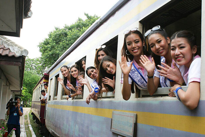 Miss Thailand World 2015 pageant contestants board Kanchanaburi province's 'Death Railway.'