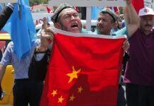 Anger With China Drives Uighurs to Syrian War Uighurs living in Turkey and Turkish supporters chant slogans on July 5, 2015, as they hold a Chinese flag before burning it during a protest near China's consulate in Istanbul. Photo: Lefteris Pitarakis / Associated Press