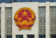 Vietnam Jails Activist for Using Facebook to Abuse Freedoms This undated photo shows the emblem of the Vietnamese communist party on a government building.