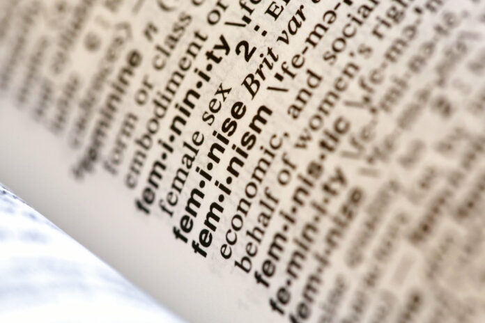 A photo taken Monday in New York shows the word feminism listed in the dictionary. Photo: Peter Morgan / Associated Press