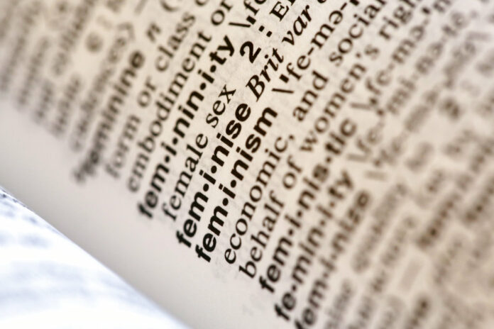 Merriam Webster Word of the Year A photo taken Monday in New York shows the word feminism listed in the dictionary. Photo: Peter Morgan / Associated Press