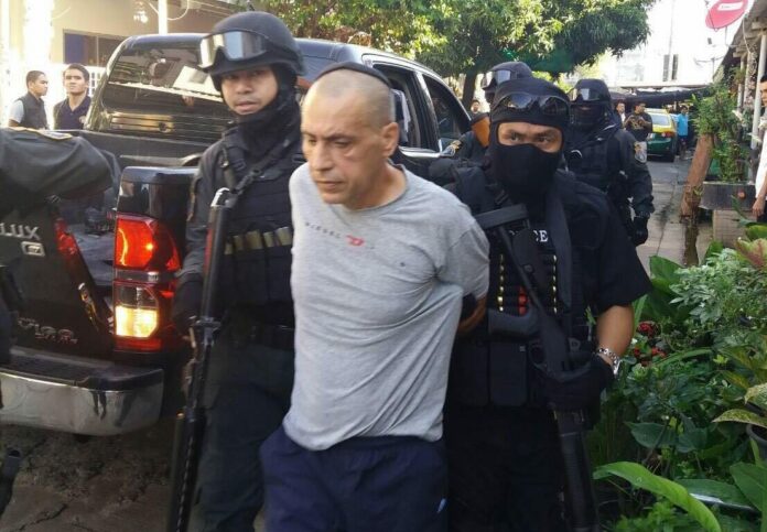Police commandos detain Shimon Sakira Bitton on Nov. 14, 2016 in Bangkok