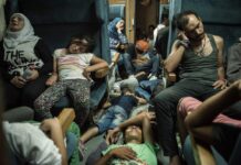 Photogs Portray Powerful Plight of Refugees at ‘Exodus’ Exhibit Syrian refugees sleep inside a train as they travel across Macedonia to Serbia. Photo: Sergey Ponomarev via Exodus-deja vu