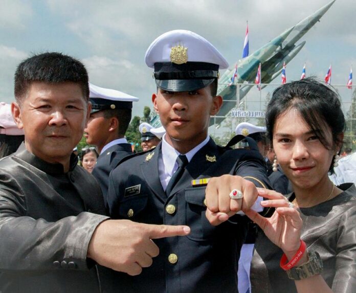 Cadet Pakapong Tanyakan poses for a photo with his parents on Aug. 16 in Nakhon Nayok province. Image: Sukanya Tanyakan / Facebook