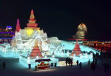Wat Phra Kaew Among Ice Festival Sculptures (Photos) Visitors walk among the attractions on Jan. 2 at the Harbin International Ice and Snow Festival in Harbin in northeastern China's Heilongjiang Province. Photo: Chinatopix