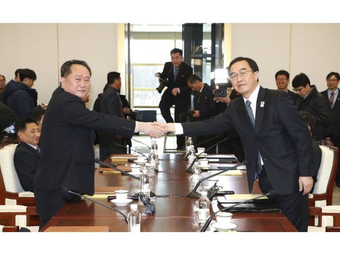 South Korean Unification Minister Cho Myoung-gyon, right, shakes hands with the head of North Korean delegation Ri Son Gwon before their meeting at the Panmunjom in the Demilitarized Zone, Tuesday in Paju, South Korea. Photo: Associated Press