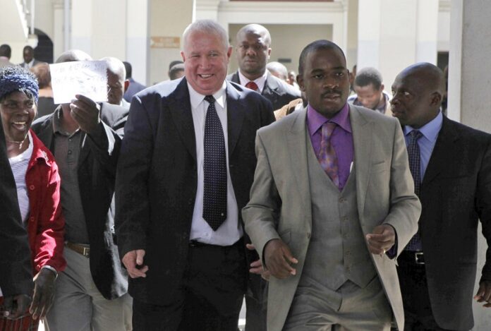 Roy Bennett, center left, leaves the High Court in 2010 in Harare, Zimbabwe, after he was acquitted of terrorism charges. Photo: Tsvangirayi Mukwazhi / Associated Press