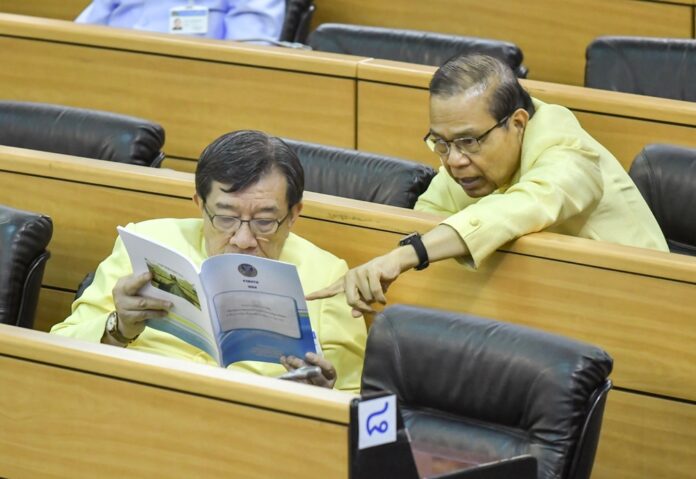 Members of the junta-appointed National Legislative Assembly, or NLA, read from a book in January during a parliamentary debate session.
