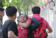 Activist Assaulted While Protesting Prawit’s Luxury Watches Undercover police drag Rittikrai Chaiwannasan away Friday moments after he assaulted pro-democracy activist Ekachai Hongkanwan.