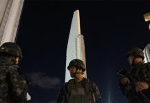 Can We Talk About Thai-Style ‘Democracy?’ Soldiers stand guard at Bangkok's Democracy Monument on May 22, 2014, hours after the army staged the 12th successful coup d'etat in modern Thai history.