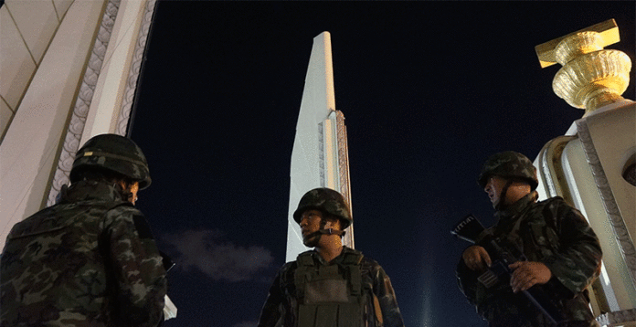 Soldiers stand guard at Bangkok's Democracy Monument on May 22, 2014, hours after the army staged the 12th successful coup d'etat in modern Thai history.