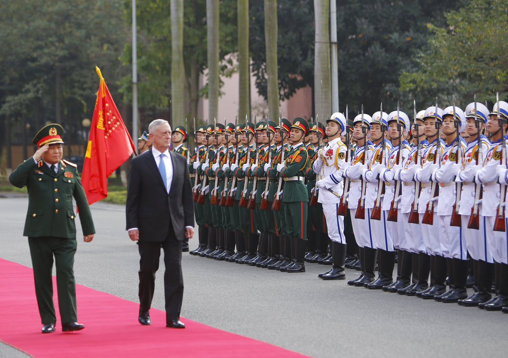 U.S. Defense Secretary Jim Mattis, at right, and his Vietnamese counterpart Ngo Xuan Lich review an honor guard before heading for talks in Hanoi on Thursday. Photo: Tran Van Minh / Associated Press