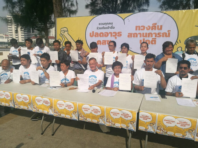 Representatives from a network of grassroots organizations calling themselves People's Network present their petition drive Monday to bring a motion to the parliament to repeal dozens of standing orders issued by the junta.