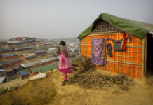 Myanmar: 1st Rohingya Camp Will Be Ready Next Week A Rohingya Muslim girl wears a sweater outside her tent Sunday in the Balukhali refugee camp 50 kilometers from Cox's Bazar, Bangladesh. Photo: Manish Swarup / Associated Press