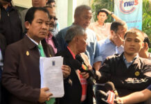 Deferring Election to 2019 a Conflict of Interest: Activist Transparency activist Srisuwan Janya presents his petition to junta leader Gen. Prayuth Chan-ocha Monday at Government House in Bangkok.