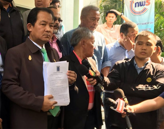 Transparency activist Srisuwan Janya presents his petition to junta leader Gen. Prayuth Chan-ocha Monday at Government House in Bangkok.