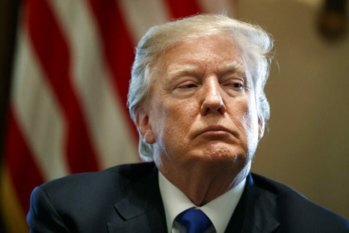 President Donald Trump listens in January during a meeting with lawmakers on immigration policy in the Cabinet Room of the White House in Washington. Photo: Evan Vucci / Associated Press