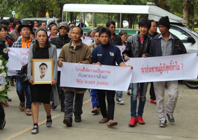 Family and friends of Sorachai Sathitraksadumrong march Friday to demand justice from Chiang Rai governor.