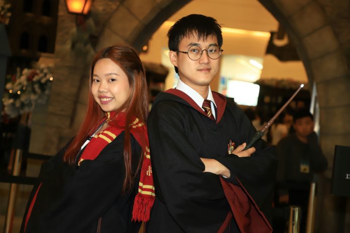 Sirapat ‘Som Joog’ Kidwisala, 22at left, and Akira Akkarakhitapisuit, 32, dress up as Ginny Weasley and Harry Potter for Children’s Day at Siam Paragon.