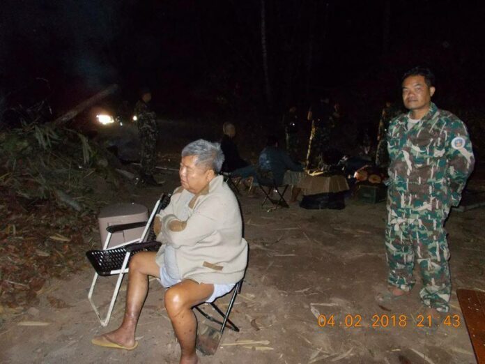 A park ranger poses for a picture with Premchai Karnasuta, president of Italian-Thai Development, after his arrest. Photo: Department of National Parks