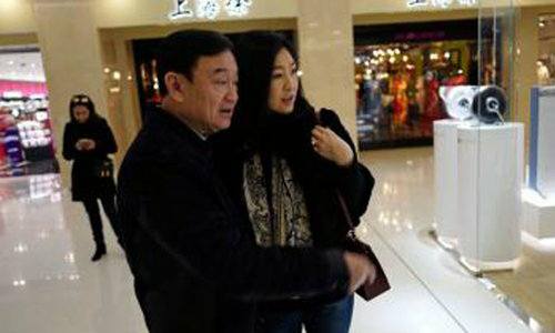 A photo on social media purported to show former prime minister Thaksin and Yingluck Shinawatra in Beijing