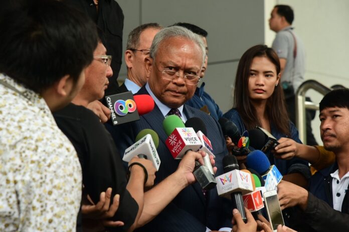Suthep Thaugsuban talks to reporters Tuesday outside a court in Bangkok