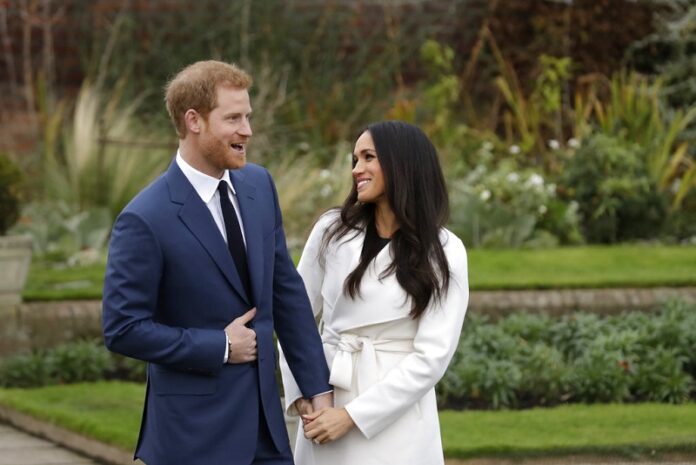 Britain's Prince Harry and his fiancee Meghan Markle pose for photographers in November in the grounds of Kensington Palace in London, following the announcement of their engagement. Photo: Matt Dunham / Associated Press