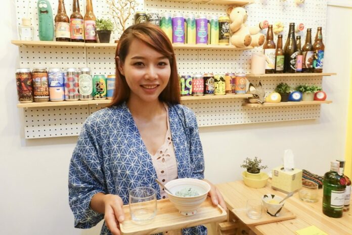 Iryn Vongvachjira holds a tray of Yoshi’s Mint Paradise, mint choc ice cream and vodka.