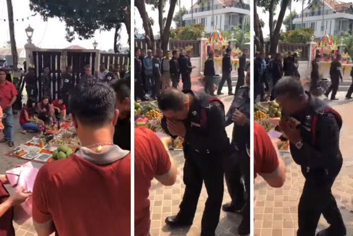 Still images from a copy of the original video showing police officers receive red envelopes with 500 baht for Chinese New Year. Image: Hotline overalls / YouTube