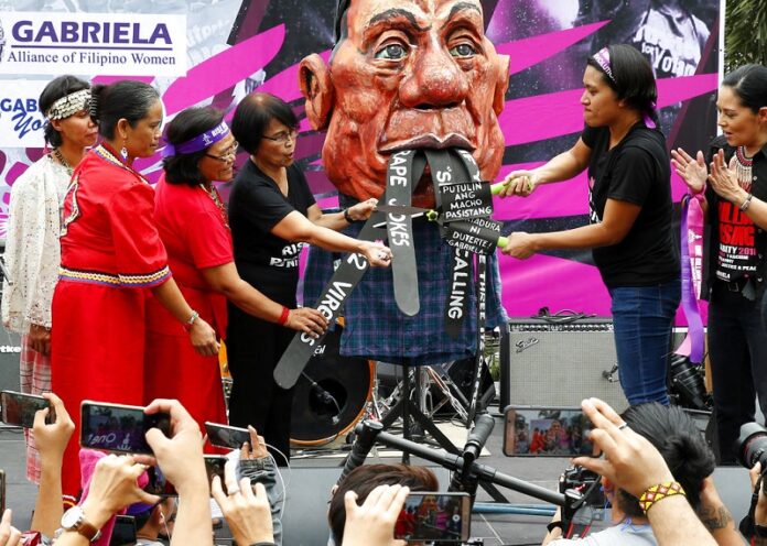 Philippine Protesters cut President Rodrigo Duterte's 