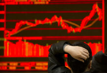 Asian Shares Up on Hopes That US, China Will Solve Dispute An investor monitors stock prices at a brokerage house in Beijing in February. Photo: Mark Schiefelbein / Associated Press