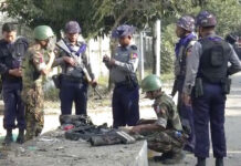 Several Bombs Set Off Around Rakhine State, 1 hurt In this image made from video, police and officials inspect the site of a bomb explosion early Saturday in Sittwe, capital of Rakhine State. Photo: Associated Press