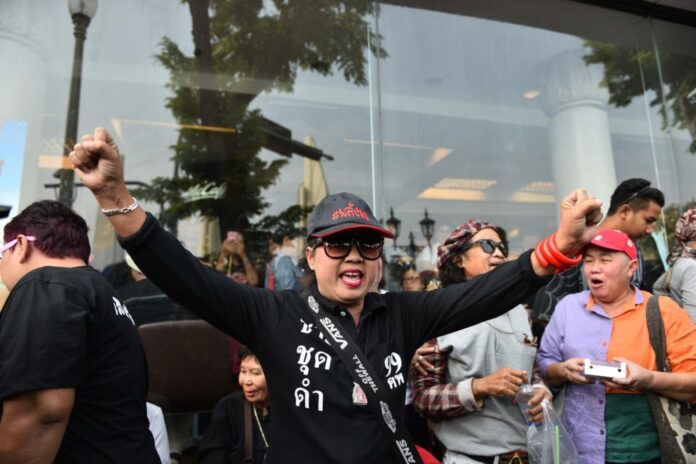 A protester shouts at a rally demanding an election near Democracy Monument on Saturday