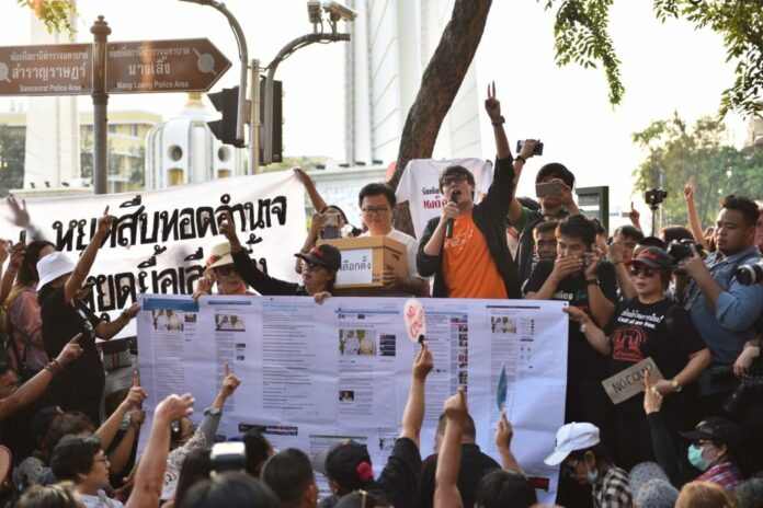 Activists speak at a Feb. 10 rally demanding an election in November