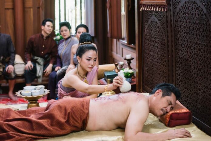 A screencap from episode 9 of Bupphesaniwat shows Junward (Kannarun Wongkajonklai) tending to her flogged father.