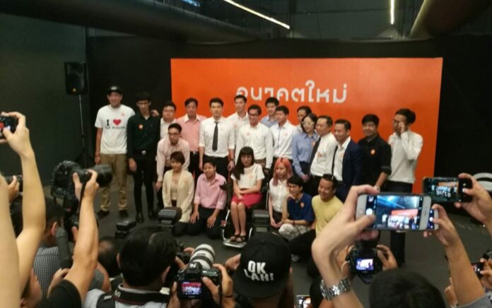 Co-founders of the newly formed Future Forward Party pose for a group photo Thursday morning in Bangkok.