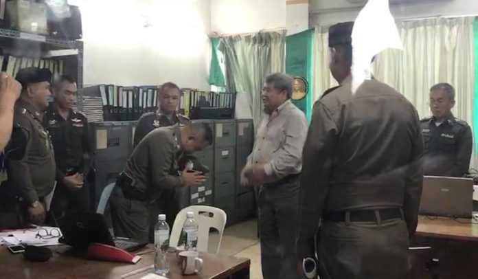 Police Gen. Srivara Ransibrahmanaku bows in a deep 'wai' to Premchai Karnasuta on Friday.