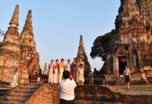 Escaping the Present For a Misremembered Past Thai tourists in traditional costumes at Wat Chaiwatthanaram. Photo: Travel @ Manager / Facebook