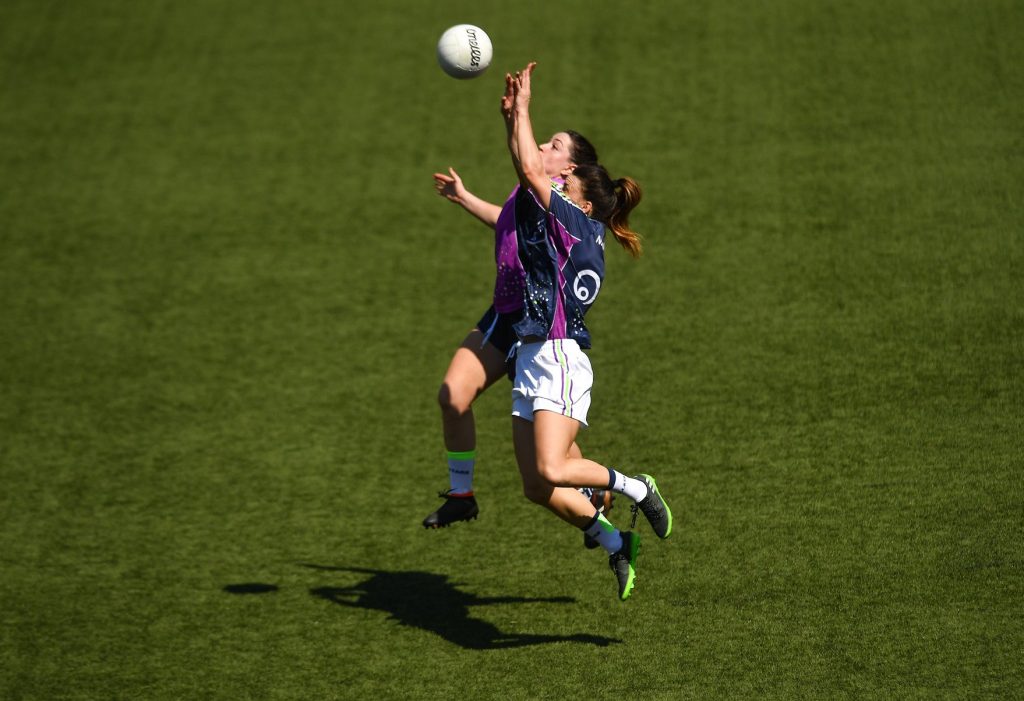 Niamh Hegarty, front, Donegal and the 2017 team, in action against Sinead Goldrick, Dublin and the 2016 team, during the exhibition match March 17 at the Chulalongkorn University Stadium. Photo: Ladies Gaelic Football / Facebook