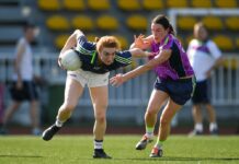 Far From Belfast, Gaelic Football Keeps Their Irish Up Top: Lauren Magee, left, Dublin and the 2017 team, in action against Sinead Aherne, Dublin and the 2016 team, during the exhibition match March 17 at the Chulalongkorn University Stadium. Photo: Ladies Gaelic Football / Facebook