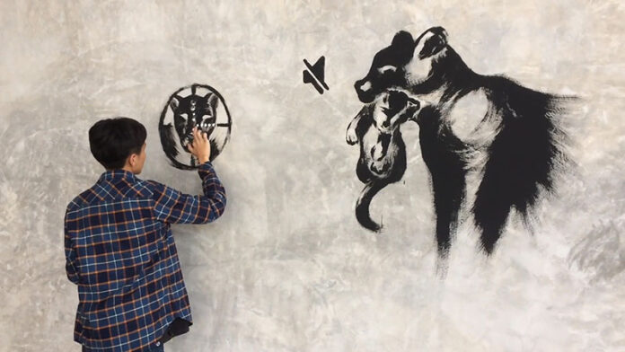 An artist paints a mural Sunday in Chiang Mai province memorializing a black panther construction magnate Premchai Karnasuta stands accused of killing.