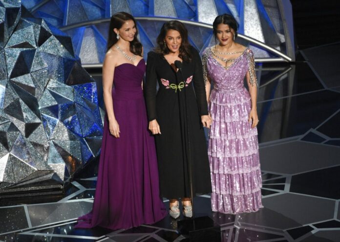 Ashley Judd, from left, Annabella Sciorra and Salma Hayek speak at the Oscars on Sunday, March 4, 2018, at the Dolby Theatre in Los Angeles. Photo: Chris Pizzello / Invision / AP